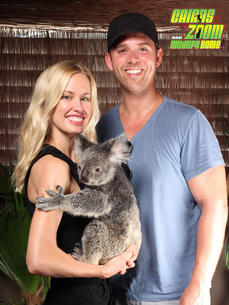 couple cuddle a koala cairns zoom and wildlife dome